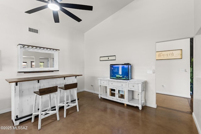 10636 E Malta St, Tucson, AZ 85747 - living room with high vaulted ceiling, ceiling fan, and finished concrete floors