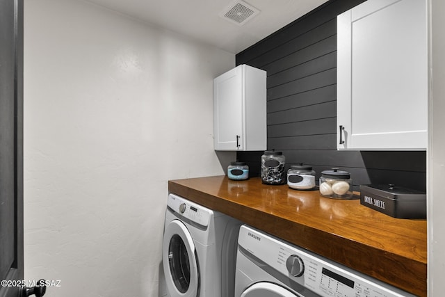 10636 E Malta St, Tucson, AZ 85747 - washroom with washing machine and dryer, cabinet space, and wooden walls