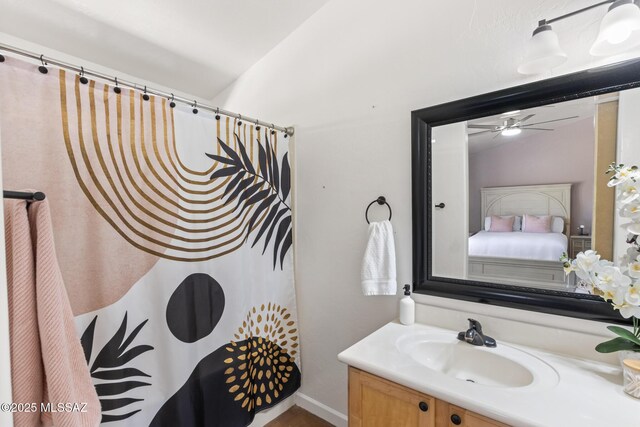 10636 E Malta St, Tucson, AZ 85747 - full bath with vanity, a ceiling fan, connected bathroom, and a shower with shower curtain