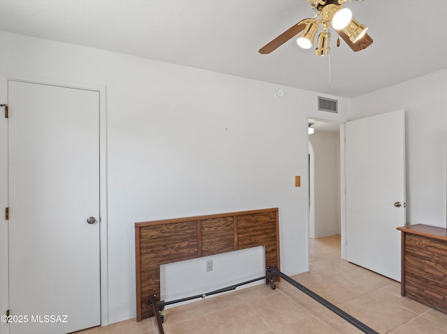 2638 N Wilson Ave, Tucson, AZ 85719 - bedroom featuring light tile patterned floors and ceiling fan