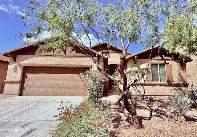 8361 N Mountain Stone Pine Way, Tucson, AZ 85743 - view of front of home featuring a garage, stucco siding, and concrete driveway