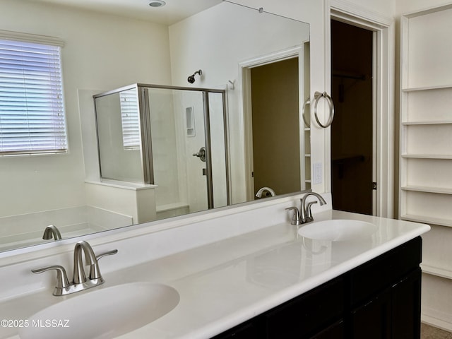 8361 N Mountain Stone Pine Way, Tucson, AZ 85743 - full bathroom featuring a stall shower, double vanity, and a walk in closet