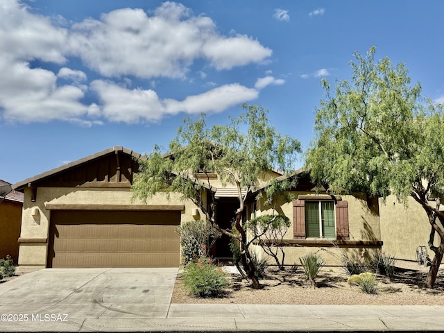 8361 N Mountain Stone Pine Way, Tucson, AZ 85743 - view of front of home with an attached garage, stucco siding, and concrete driveway