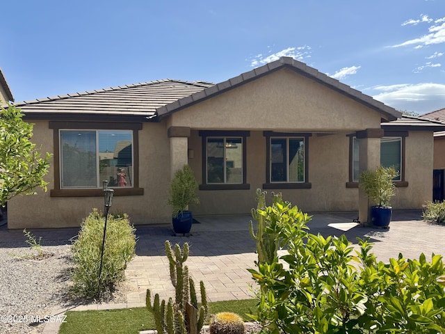 8361 N Mountain Stone Pine Way, Tucson, AZ 85743 - bungalow with stucco siding, a patio area, and a tiled roof