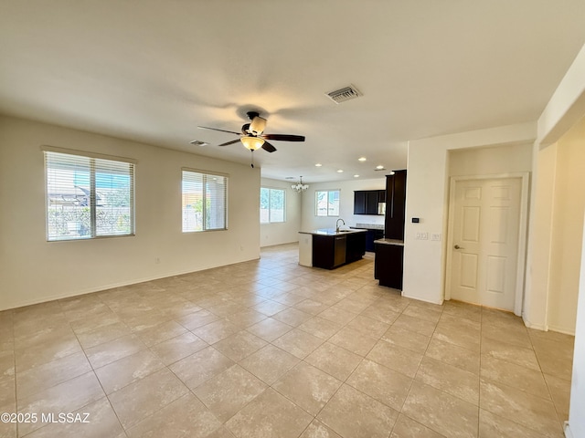 8361 N Mountain Stone Pine Way, Tucson, AZ 85743 - unfurnished living room with a ceiling fan, light tile patterned floors, and recessed lighting