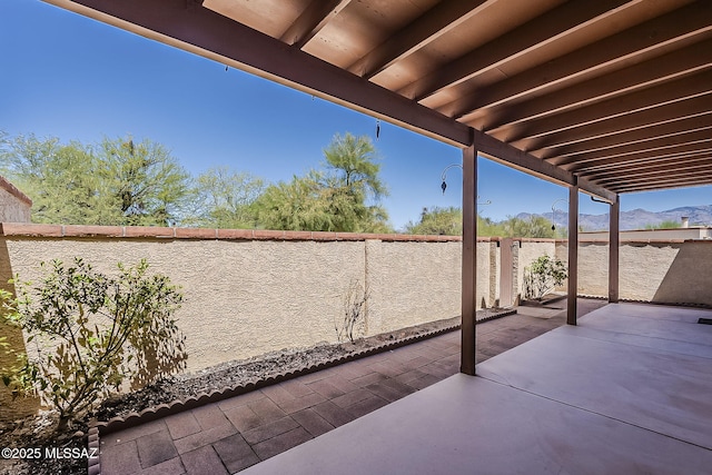 9453 E Calle Bolivar, Tucson, AZ 85715 - fenced backyard featuring a patio and a mountain view