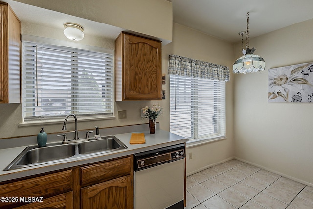9453 E Calle Bolivar, Tucson, AZ 85715 - kitchen featuring white dishwasher, healthy amount of natural light, light countertops, and light tile patterned floors