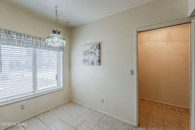 9453 E Calle Bolivar, Tucson, AZ 85715 - unfurnished dining area featuring light tile patterned flooring