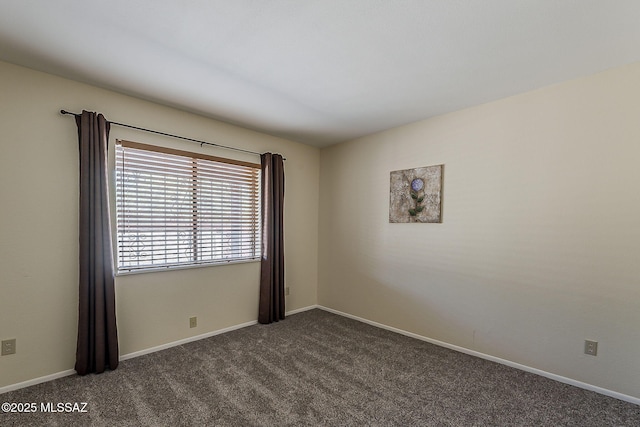 9453 E Calle Bolivar, Tucson, AZ 85715 - unfurnished room featuring dark colored carpet and baseboards