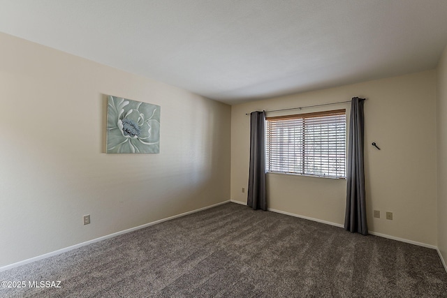 9453 E Calle Bolivar, Tucson, AZ 85715 - empty room featuring dark carpet and baseboards