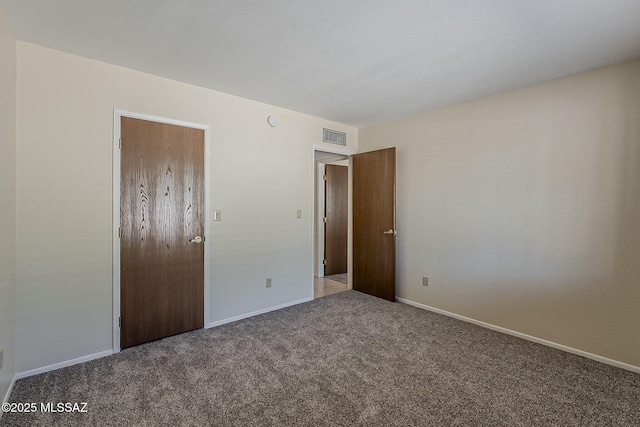 9453 E Calle Bolivar, Tucson, AZ 85715 - carpeted empty room with baseboards