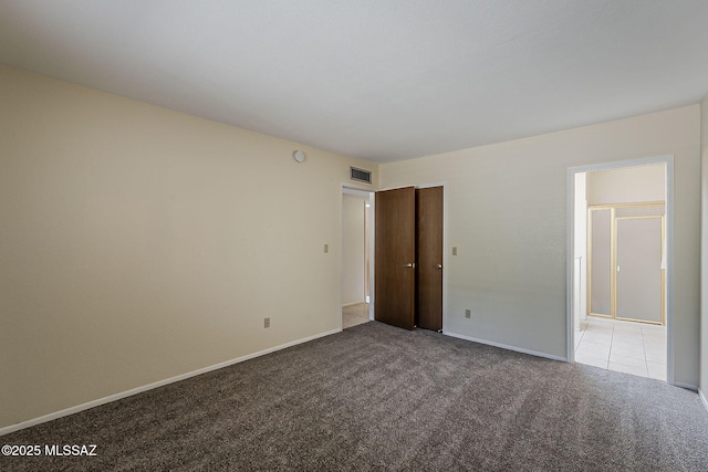 9453 E Calle Bolivar, Tucson, AZ 85715 - unfurnished bedroom with carpet flooring and baseboards