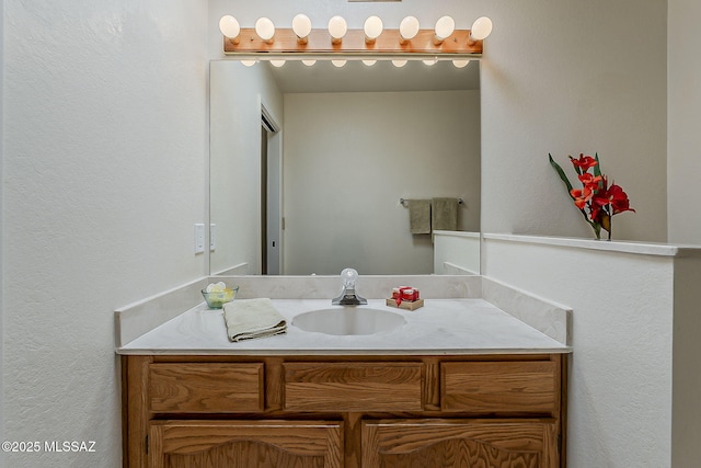 9453 E Calle Bolivar, Tucson, AZ 85715 - bathroom featuring vanity and a textured wall