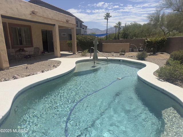 13049 N Woosnam Way, Oro Valley, AZ 85755 - view of swimming pool with a patio area and a mountain view