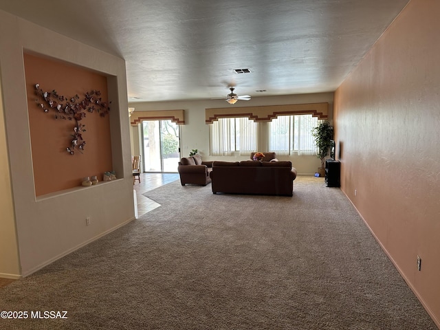 13049 N Woosnam Way, Oro Valley, AZ 85755 - living area with carpet floors and ceiling fan