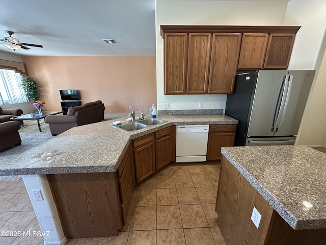 13049 N Woosnam Way, Oro Valley, AZ 85755 - kitchen with dishwasher, freestanding refrigerator, open floor plan, light tile patterned floors, and ceiling fan
