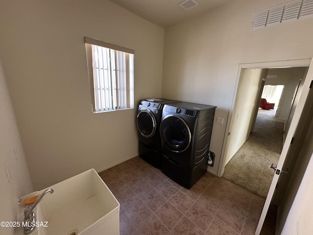 13049 N Woosnam Way, Oro Valley, AZ 85755 - laundry room featuring independent washer and dryer and tile patterned floors