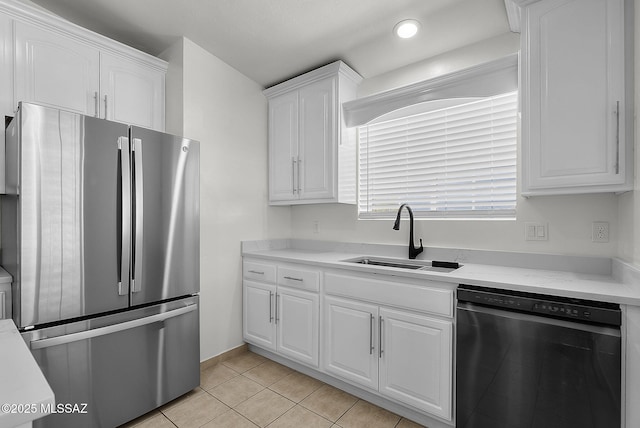 446 Soda Ln, Rio Rico, AZ 85648 - kitchen featuring freestanding refrigerator, dishwashing machine, white cabinetry, light tile patterned flooring, and recessed lighting