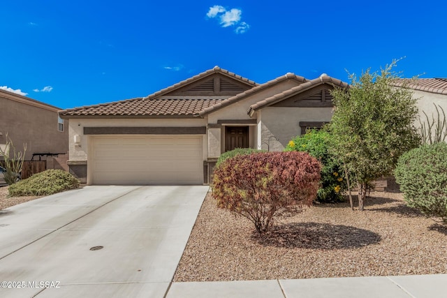 276 W Charles L Mckay St, Vail, AZ 85641 - view of front of house with driveway, a garage, stucco siding, and a tiled roof