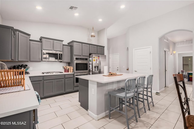 276 W Charles L Mckay St, Vail, AZ 85641 - kitchen featuring stainless steel appliances, arched walkways, light tile patterned floors, light countertops, and recessed lighting