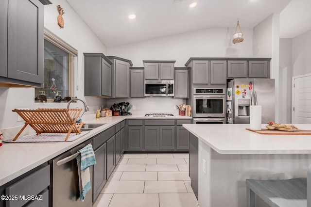 276 W Charles L Mckay St, Vail, AZ 85641 - kitchen featuring stainless steel appliances, lofted ceiling, light countertops, gray cabinetry, and light tile patterned floors