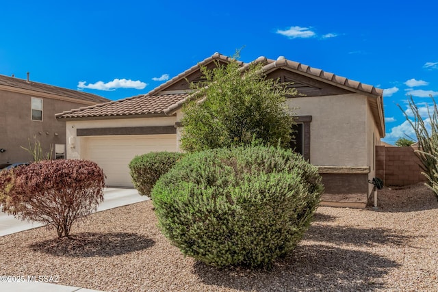 276 W Charles L Mckay St, Vail, AZ 85641 - view of front facade with a garage, a tile roof, and stucco siding