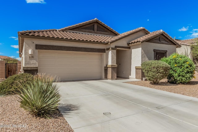 276 W Charles L Mckay St, Vail, AZ 85641 - mediterranean / spanish home with an attached garage, stucco siding, concrete driveway, and a tiled roof