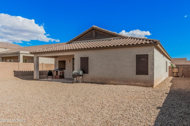 276 W Charles L Mckay St, Vail, AZ 85641 - back of property with a patio, a fenced backyard, stucco siding, and a tiled roof
