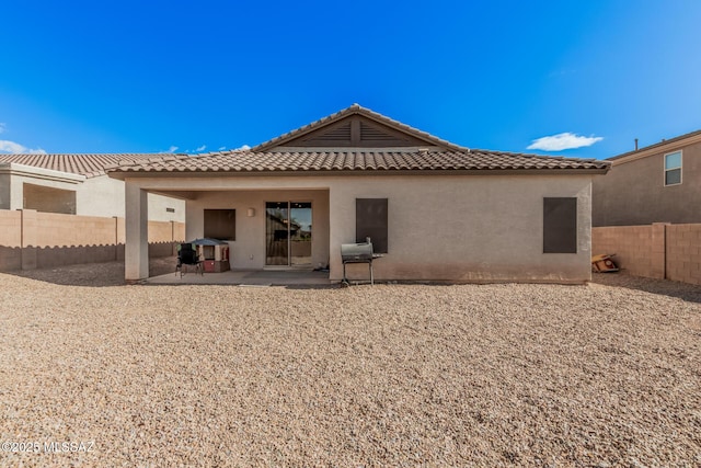 276 W Charles L Mckay St, Vail, AZ 85641 - back of property featuring a tile roof, stucco siding, a fenced backyard, and a patio area