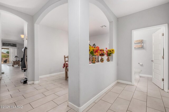 276 W Charles L Mckay St, Vail, AZ 85641 - hall with arched walkways and light tile patterned flooring