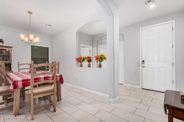 276 W Charles L Mckay St, Vail, AZ 85641 - dining area featuring a chandelier, arched walkways, and light tile patterned floors