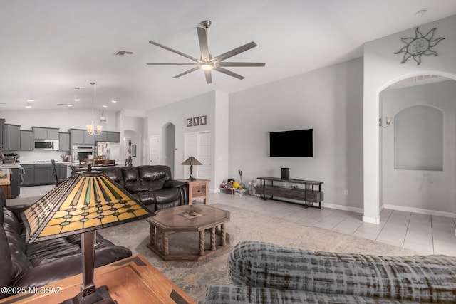 276 W Charles L Mckay St, Vail, AZ 85641 - living room with arched walkways, vaulted ceiling, ceiling fan, and light tile patterned flooring