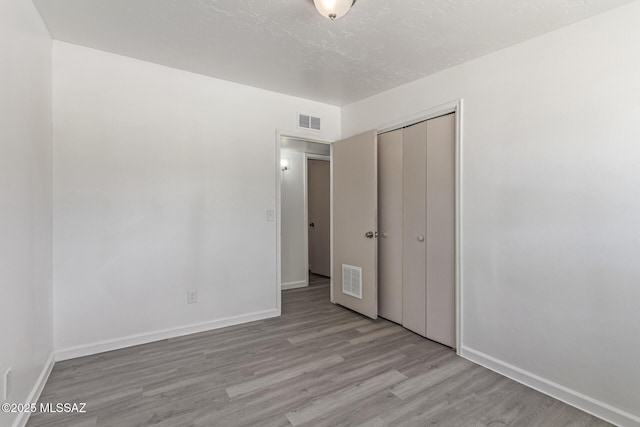 4041 E Dover Stra, Tucson, AZ 85706 - unfurnished bedroom with wood finished floors and a closet