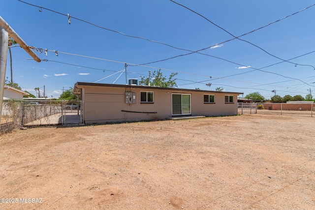 4041 E Dover Stra, Tucson, AZ 85706 - rear view of house featuring a gate