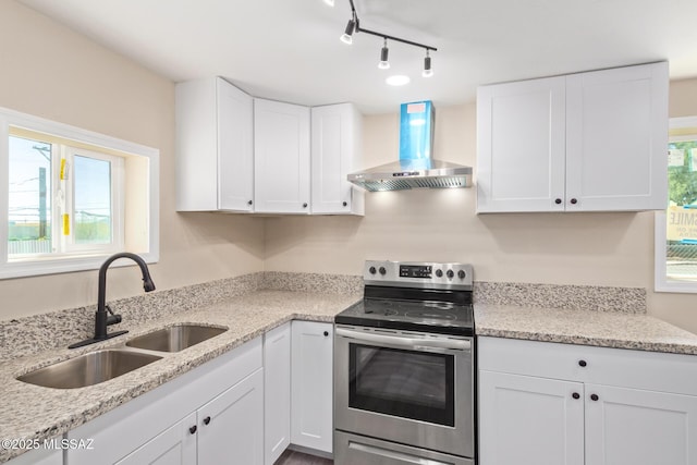 2514 N Castro Ave, Tucson, AZ 85705 - kitchen featuring wall chimney range hood, stainless steel electric range oven, white cabinetry, and light stone counters