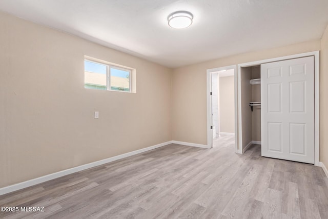 2514 N Castro Ave, Tucson, AZ 85705 - unfurnished bedroom featuring a closet and light wood-style flooring
