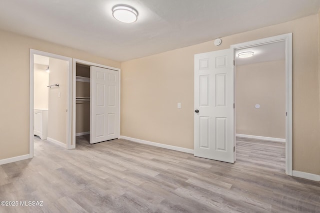 2514 N Castro Ave, Tucson, AZ 85705 - unfurnished bedroom featuring wood finished floors and a closet