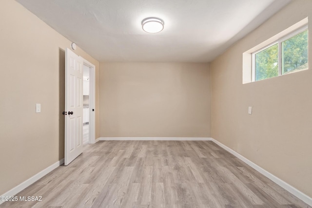 2514 N Castro Ave, Tucson, AZ 85705 - spare room featuring light wood-style flooring and baseboards