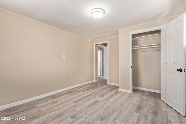 2514 N Castro Ave, Tucson, AZ 85705 - unfurnished bedroom with light wood-style floors and a closet