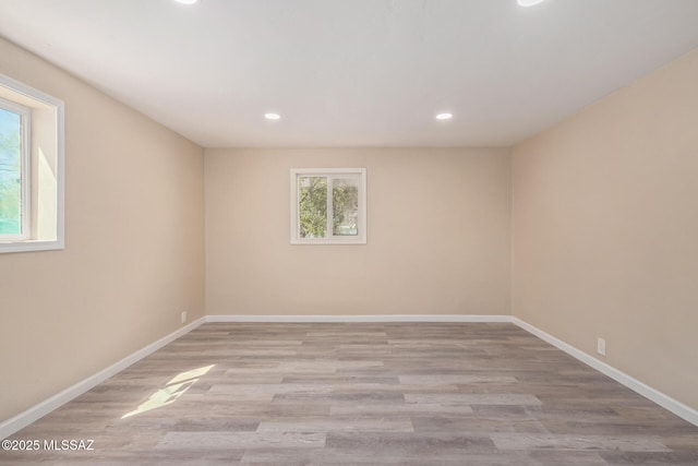 2514 N Castro Ave, Tucson, AZ 85705 - empty room featuring healthy amount of natural light, recessed lighting, and light wood-style flooring
