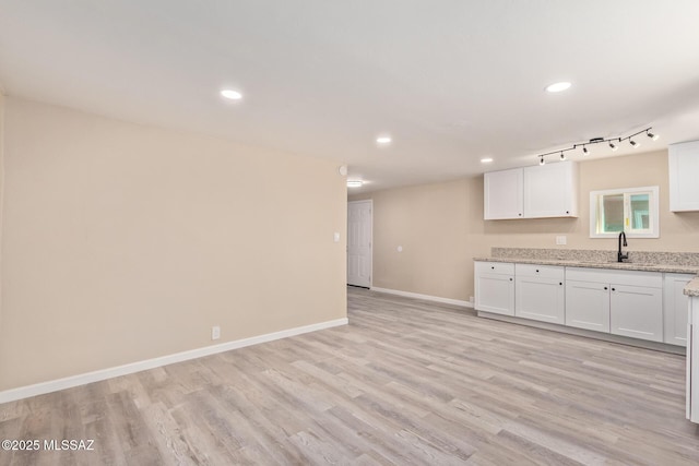 2514 N Castro Ave, Tucson, AZ 85705 - kitchen with white cabinets, recessed lighting, light wood-style flooring, and light stone counters