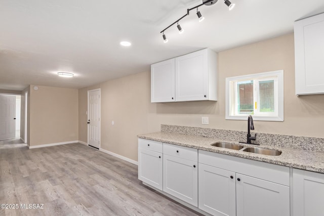 2514 N Castro Ave, Tucson, AZ 85705 - kitchen with white cabinets, light wood-style flooring, light stone counters, track lighting, and recessed lighting