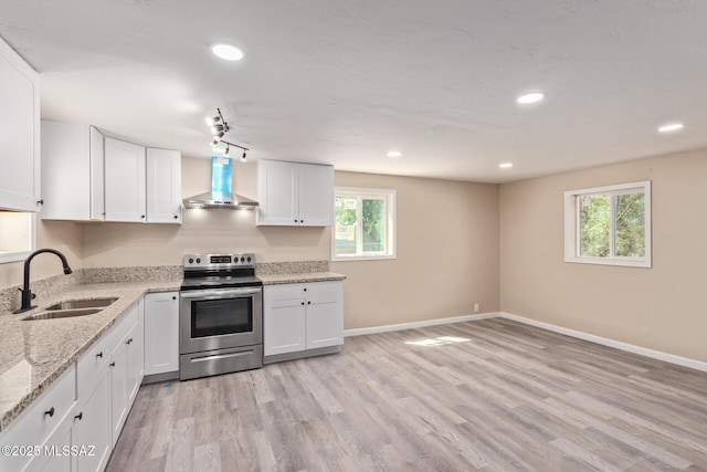 2514 N Castro Ave, Tucson, AZ 85705 - kitchen featuring electric stove, wall chimney exhaust hood, white cabinets, and recessed lighting