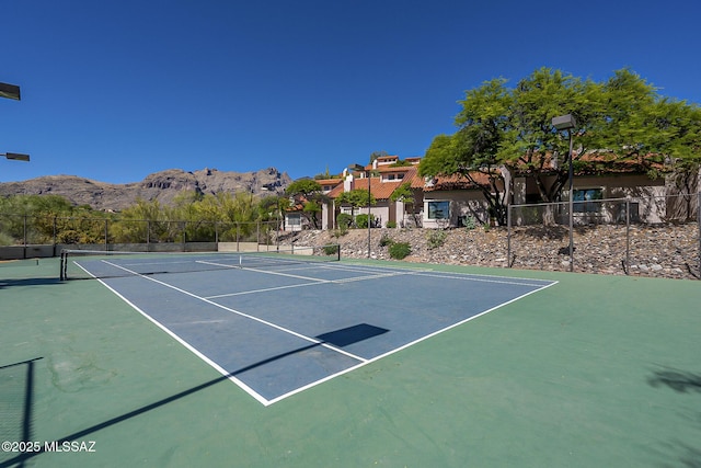 6490 N Tierra De Las Catalinas Unit 94, Tucson, AZ 85718 - view of tennis court with a mountain view and community basketball court