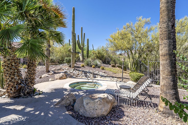 6490 N Tierra De Las Catalinas Unit 94, Tucson, AZ 85718 - view of patio / terrace featuring an in-ground hot tub