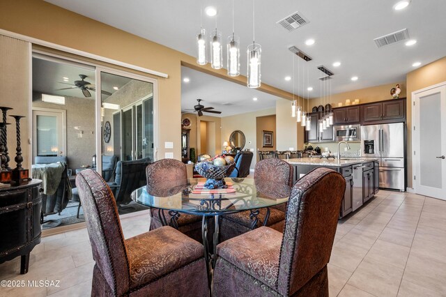 14326 Whitehorn Pl, Marana, AZ 85658 - dining space with ceiling fan, light tile patterned floors, and recessed lighting