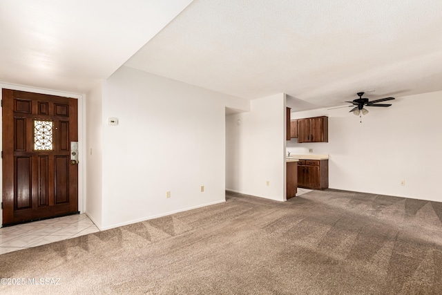 6635 E Golf Links Rd Apt 1, Tucson, AZ 85730 - unfurnished living room with light colored carpet and a ceiling fan