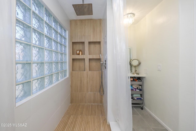 6976 Somerton Dr, Tucson, AZ 85743 - full bathroom with tiled shower and tile patterned floors