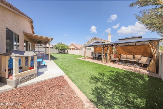 6976 Somerton Dr, Tucson, AZ 85743 - fenced backyard with outdoor lounge area, a gazebo, and a patio area