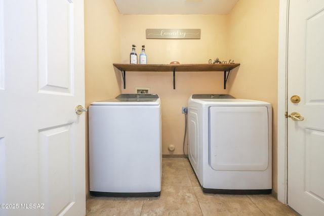 6976 Somerton Dr, Tucson, AZ 85743 - washroom featuring washing machine and clothes dryer and light tile patterned floors
